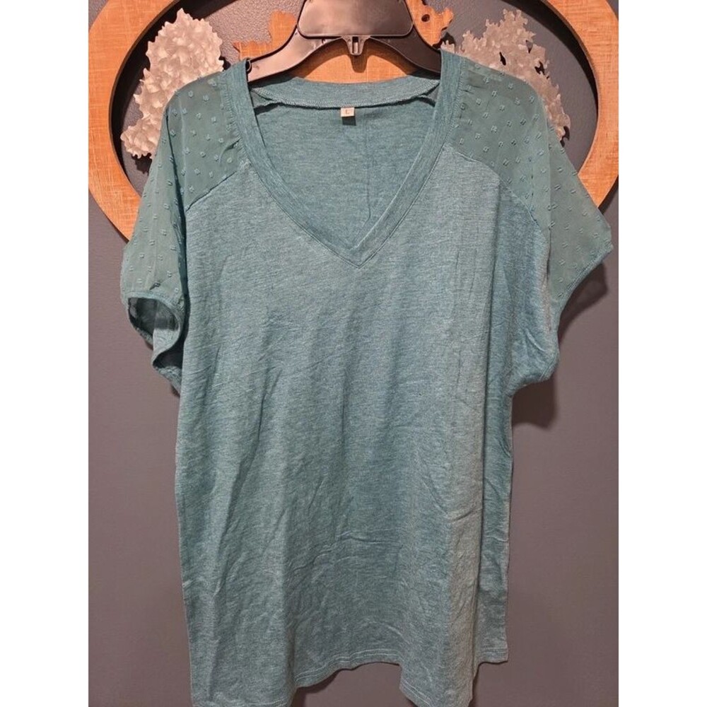 Woman's large short sleeve shirt with see through shoulder